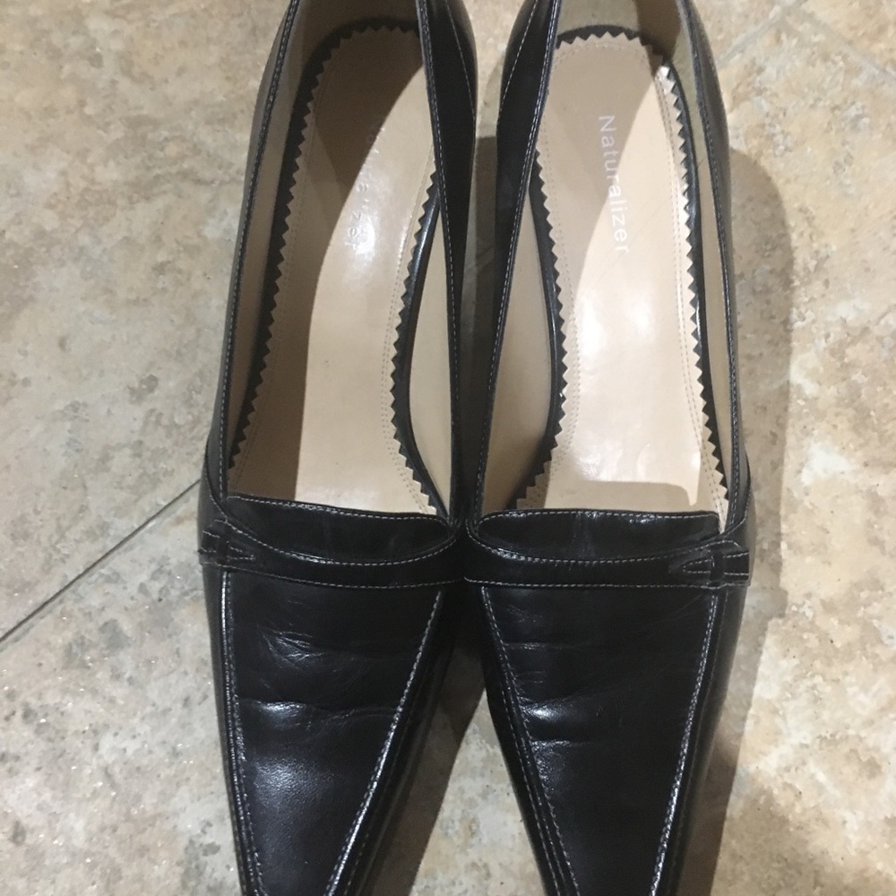 Never worn!  Naturalized black heel with strap